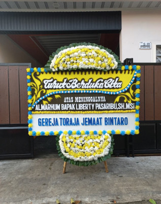 Papan Bunga Duka di Langkapura Baru